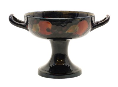 Lot 141 - A William Moorcroft 'Pomegranate' twin-handled pedestal bowl