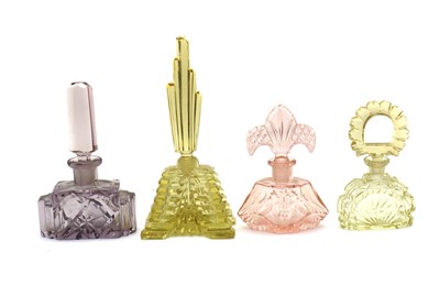 Lot 214 - A collection of four Art Deco perfume bottles
