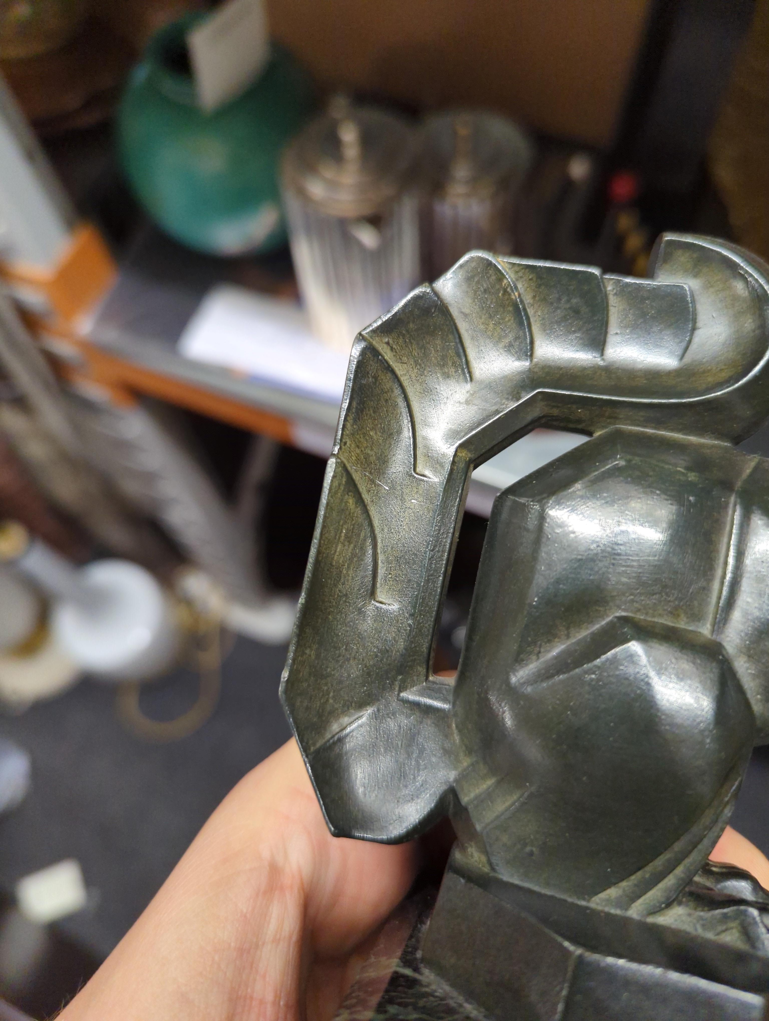 Lot 90 A pair of art metal squirrel bookends,