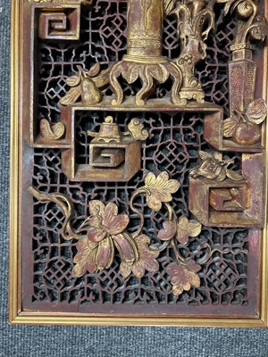 Lot 117 - A pair of Chinese gilt lacquered wood panels