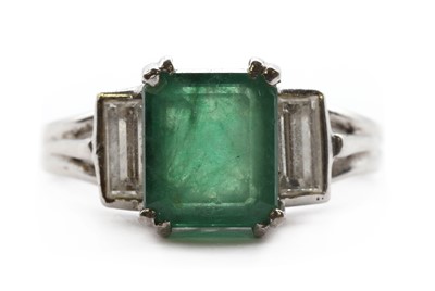 Lot 233 - A white gold emerald and diamond three stone ring