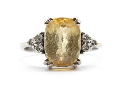 Lot A white gold yellow topaz and diamond ring