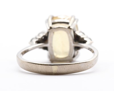 Lot A white gold yellow topaz and diamond ring