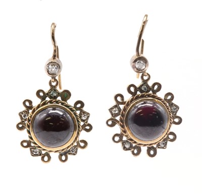 Lot 172 - A pair of gold and silver, garnet and diamond drop earrings