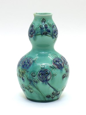 Lot 144 - A William Moorcroft for Liberty & Co. Florianware double gourd vase