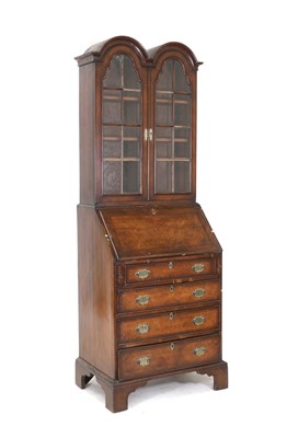 Lot 357 - A walnut double dome bureau bookcase