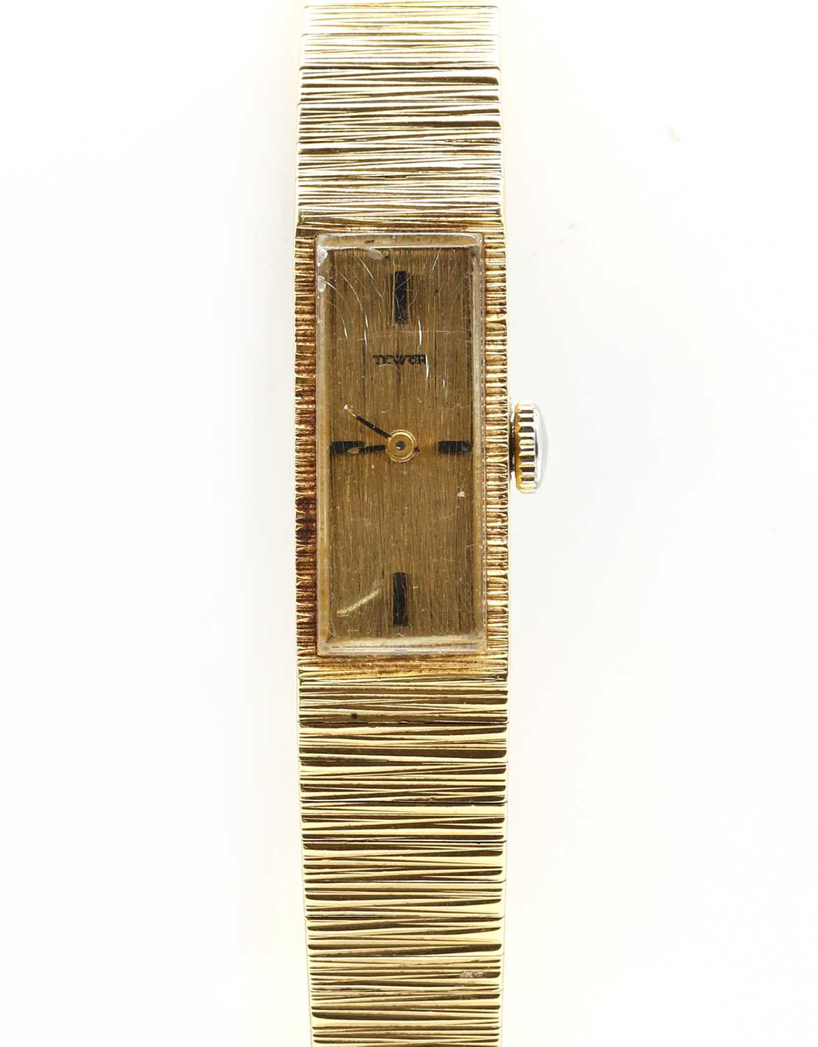 Lot 499 - A ladies' 18ct gold Tewor mechanical bracelet watch