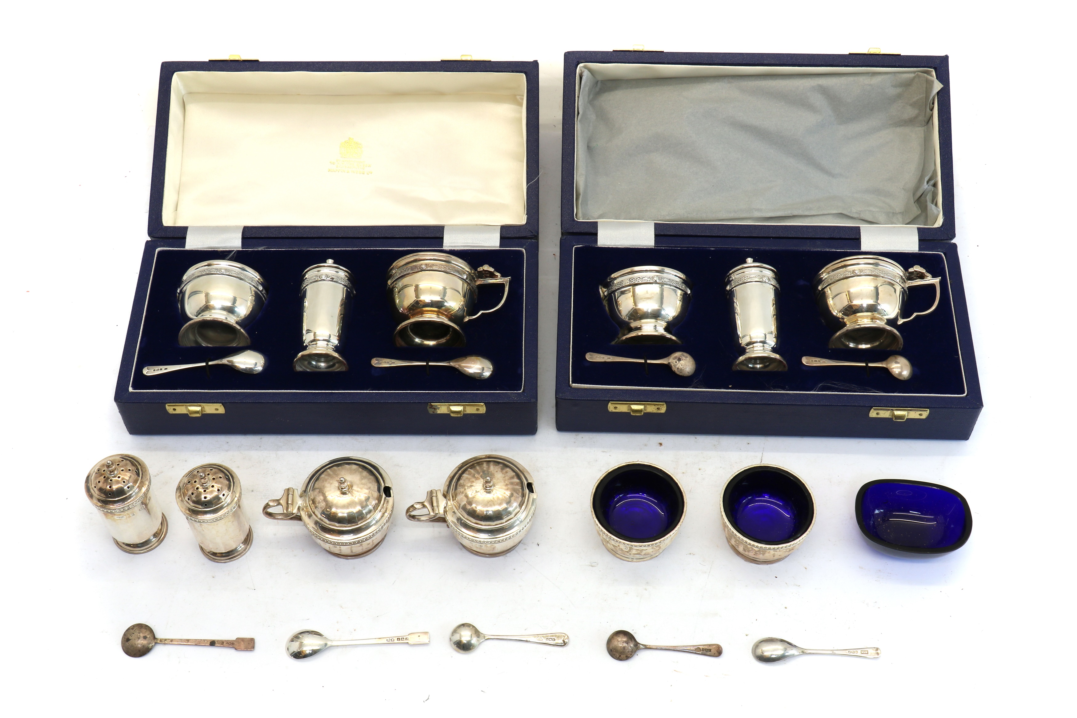 Lot 54 A pair of silver cruet sets