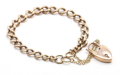 Lot 433 - A gold curb link bracelet