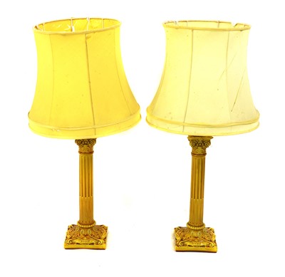 Lot 218A - A pair of Burmantofts Faience yellow glazed column lamps