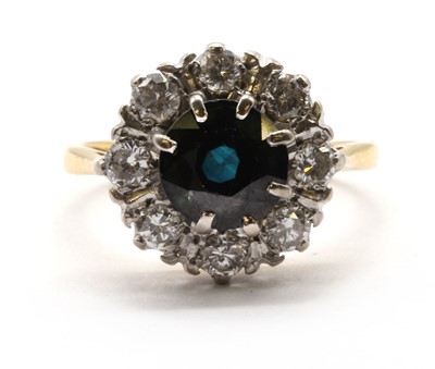 Lot 266 - An 18ct gold sapphire and diamond cluster ring