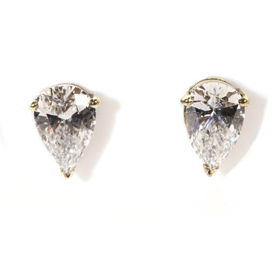 Lot 249 - A pair of gold single stone diamond earrings