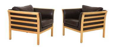 Lot 344 - A pair of Danish oak and chocolate leather armchairs