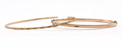 Lot 408 - Two gold bangles