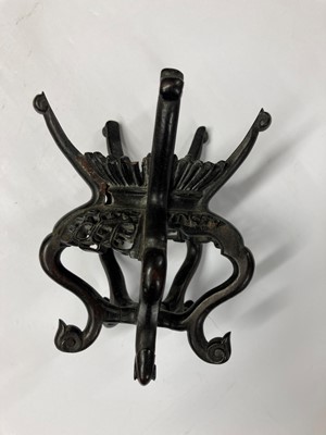 Lot 86 - A collection of Chinese wood stands