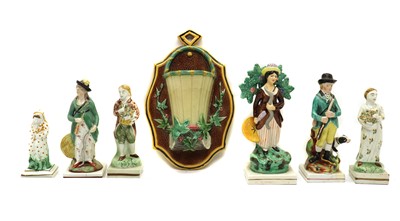 Lot 109 - A collection of Staffordshire rural figures