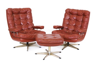 Lot 363 - A pair of Danish leather lounge chairs and an ottoman