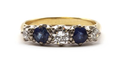 Lot 154 - A gold five stone diamond and sapphire ring