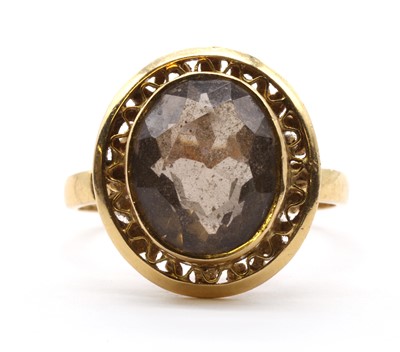 Lot 130 - A gold single stone smoky quartz ring