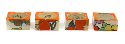 Lot 214 - A collection of four Clarice Cliff napkin rings