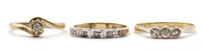 Lot 254 - A three gold diamond set rings