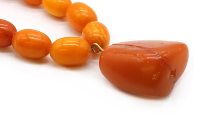Lot 90 - A single row graduated butterscotch amber bead necklace