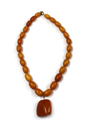 Lot 90 - A single row graduated butterscotch amber bead necklace