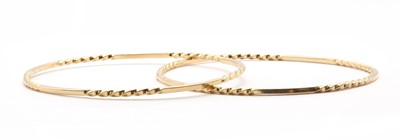 Lot 345 - A pair of gold bangles