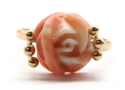 Lot 166 - A gold carved coral rose ring