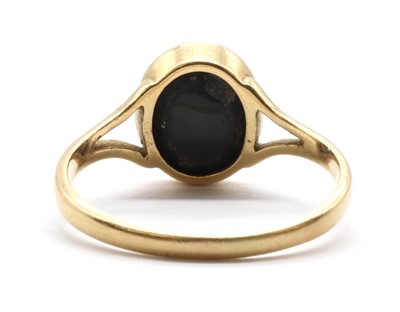 Lot 51 - A gold single stone black opal ring