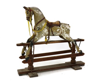 Lot 298 - A large painted wood rocking horse on stand