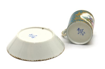 Lot 76 - A Sèvres style porcelain cup and saucer