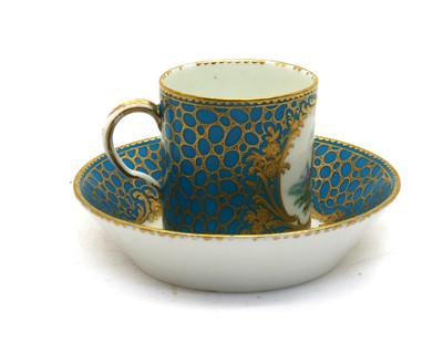 Lot 76 - A Sèvres style porcelain cup and saucer