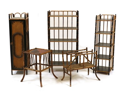 Lot 491 - An ebonised and bamboo four-tier étagère