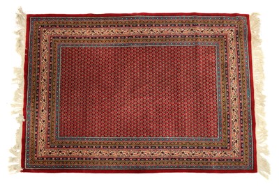 Lot 214A - A modern Senneh pattern red ground wool rug