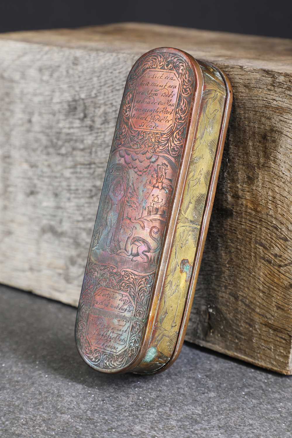 Lot 16 - A copper and brass tobacco box