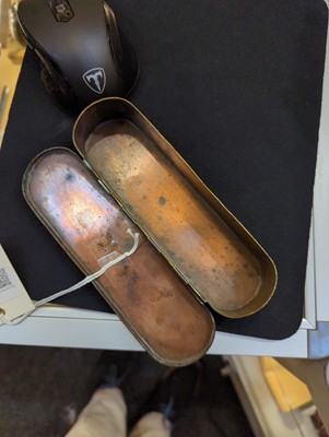 Lot 16 - A copper and brass tobacco box