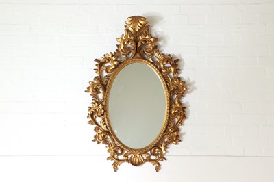 Lot 224 - A carved giltwood mirror in the Florentine style