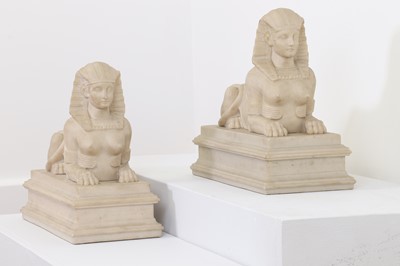 Lot 258 - A pair of imitation marble sphinx figures