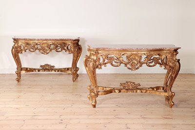 Lot 600 - A pair of giltwood and rouge marble console tables