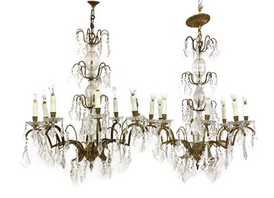 Lot 579 - A pair of gilt-metal and glass chandeliers