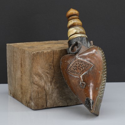 Lot 173 - An Ottoman brass-mounted heart-shaped wooden powder flask