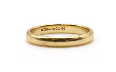 Lot 128 - An 18ct gold 'D' section wedding ring, by Tiffany & Co.