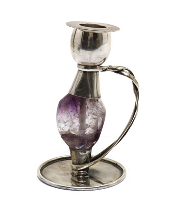 Lot 45 - An Arts & Crafts style silver and amethyst candlestick
