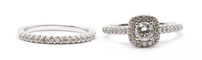 Lot 196 - An 18ct white gold wedding and engagement ring set