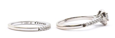Lot 196 - An 18ct white gold wedding and engagement ring set