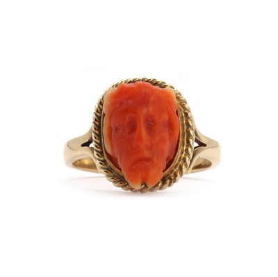 Lot 68 - A gold and carved coral cameo ring