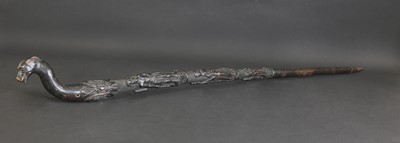 Lot 12 - A carved folk art bog oak walking stick