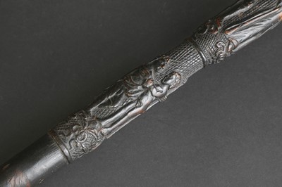 Lot 12 - A carved folk art bog oak walking stick