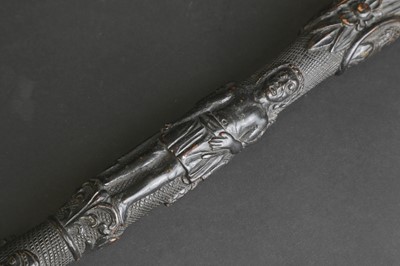 Lot 12 - A carved folk art bog oak walking stick